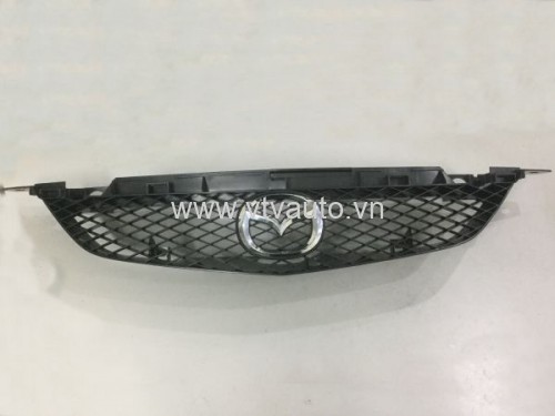 Mặt ca lăng Mazda 323, 2000-2004